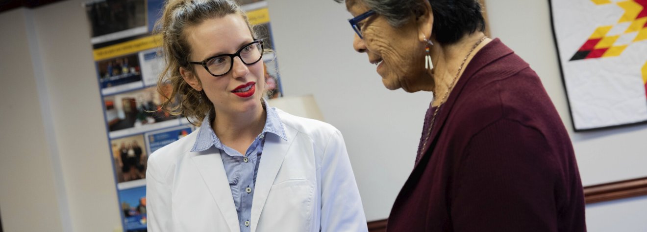 Student talking with an advisor.